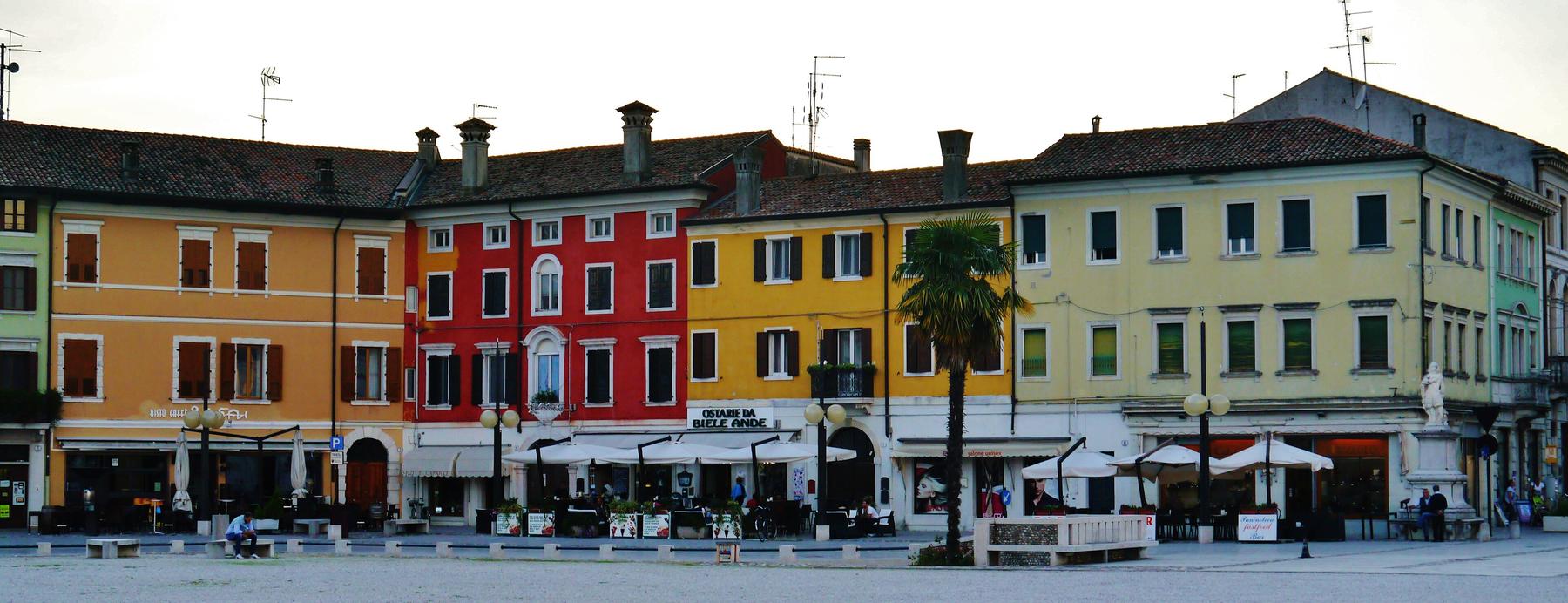 Colourful palazzi and cafés lining the hexagonal Piazza Grande in Palmanova