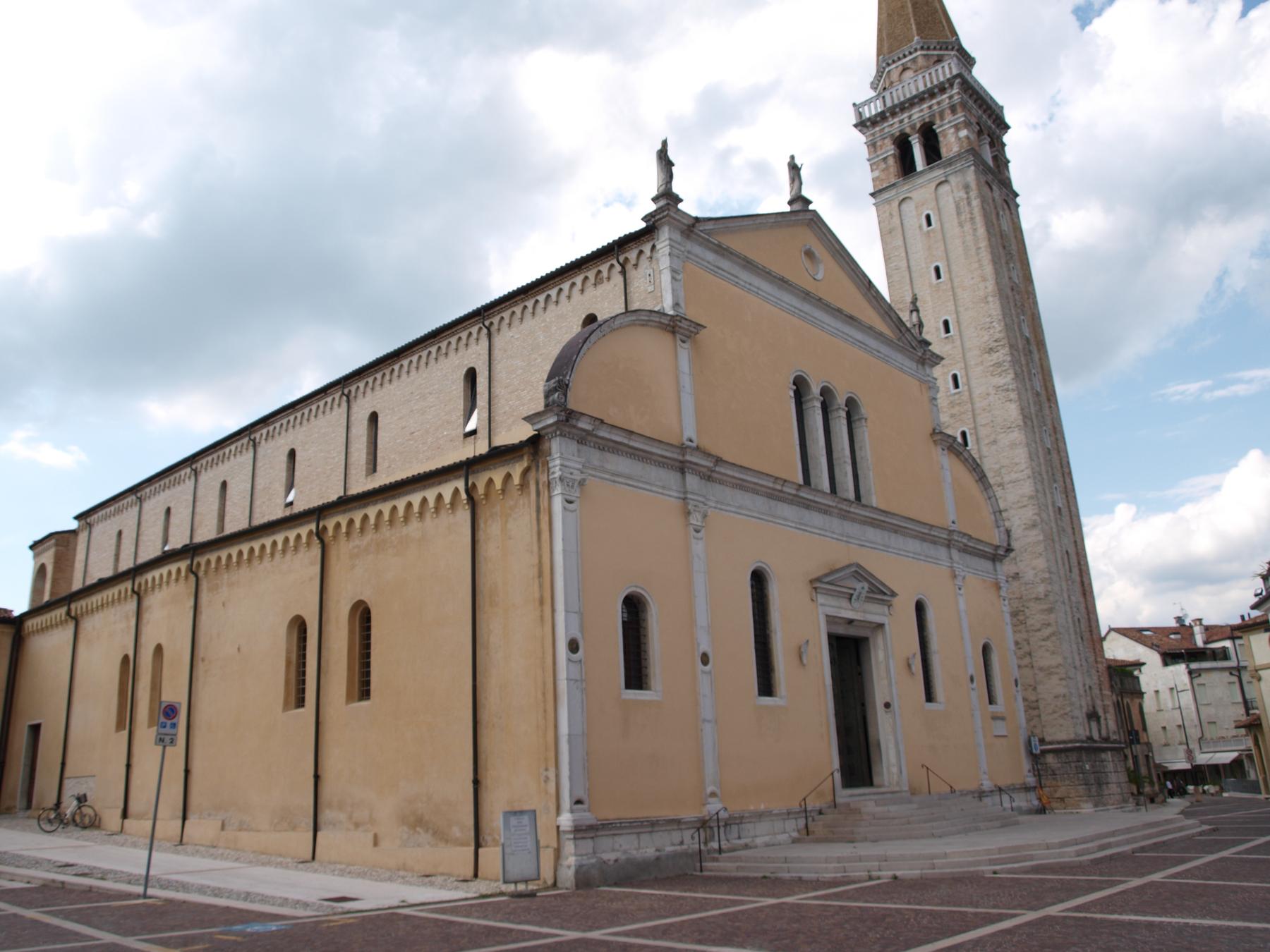Ochre facade and tall bell tower of the Duomo di San Nicolò, Sacile