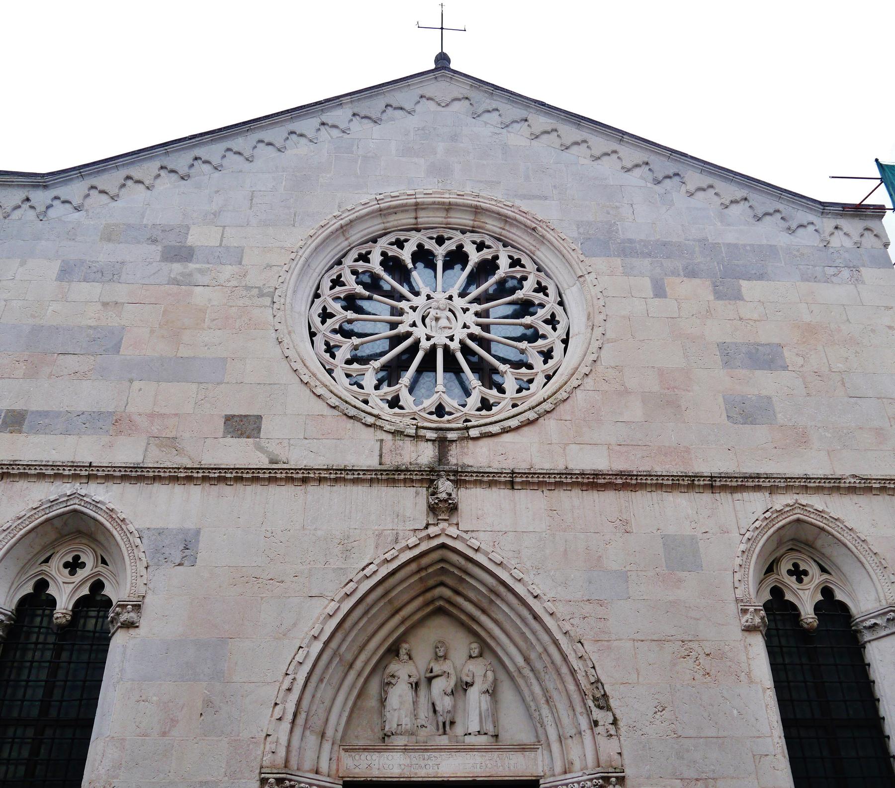 Gothic stone facade with rose window of Sant'Antonio Abate, San Daniele